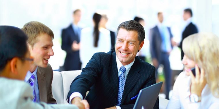 man shaking hands representing insurance bonds